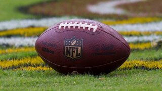LANDOVER, MD – AUGUST 27: A regulation sized footbal with NFL logo resting on the field prior to the NFL preseason game between the Cincinnati Bengals and the Washington Redskins on August 27, 2017, at FedEx Field in Landover, MD. (Photo by Lee Coleman/Icon Sportswire)
