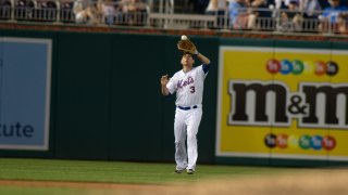 Tom Suozzi playing on Congressional Baseball game in Mets uniform