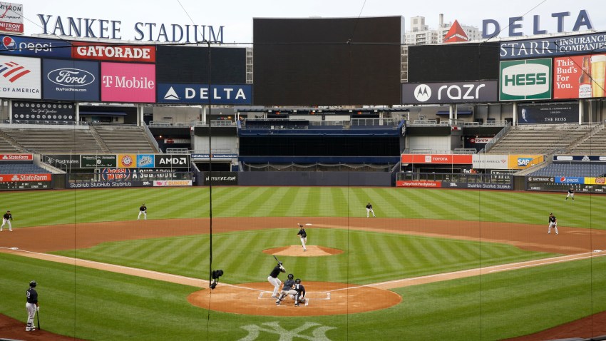 New York Yankees starting pitcher J.A. Happ throws to Miguel Andujar during the first inning of an intrasquad baseball game Monday, July 6, 2020, at Yankee Stadium in New York.