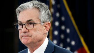 FILE - In this March 3, 2020, file photo, Federal Reserve Chair Jerome Powell pauses during a news conference to discuss an announcement from the Federal Open Market Committee, in Washington. In a series of sweeping steps, the U.S. Federal Reserve will lend to small and large businesses and local governments as well as extend its bond buying programs as part of the Fed's ongoing efforts to support the flow of credit through an economy ravaged by the COVID-19 outbreak.