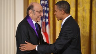 In this Feb. 25, 2010, file photo, U.S. President Barack Obama shakes hands with graphic designer Milton Glaser after presenting him with the 2009 National Medal of Arts during a ceremony in the East Room of the White House in Washington, DC.