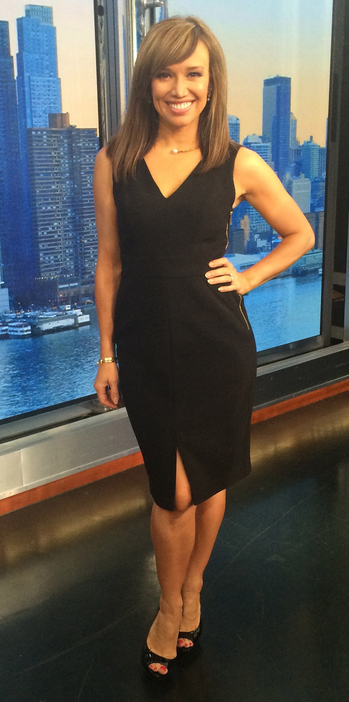 black dress with emerald green accessories