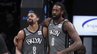 DeAndre Jordan #6 and Spencer Dinwiddie #8 of the Brooklyn Nets