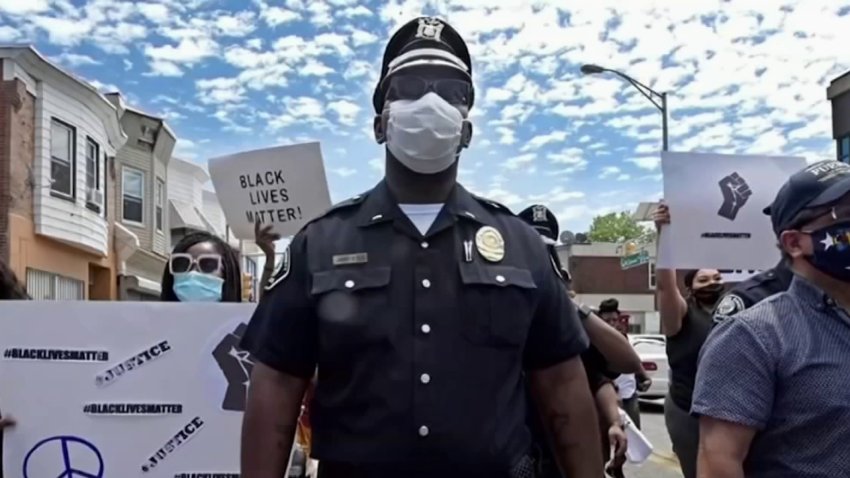 Camden police officer marches with protesters