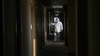 This photo taken on Feb. 3, 2020, shows a medical staff member disinfecting a quarantine zone in a hotel in Wuhan, in China's central Hubei province.