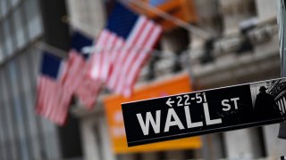 This Jan. 31, 2020, file photo shows a Wall Street sign in front of the New York Stock Exchange.