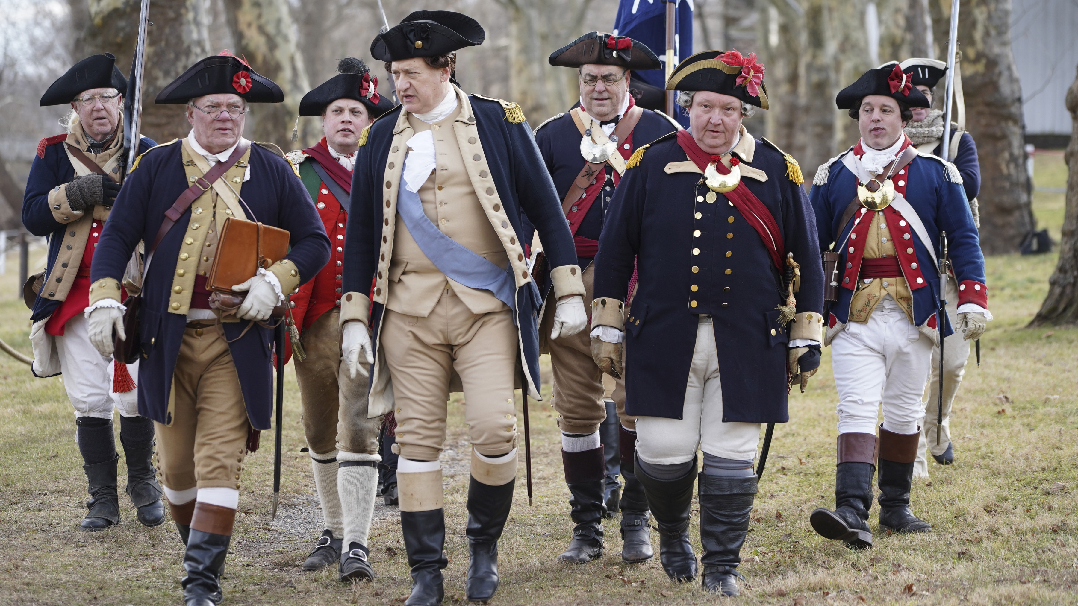 Revolutionary war re-enactors participate in the 66th annual re-enactment of General George Washington crossing the Delaware River, Tuesday Dec. 25, 2018, in Upper Makefield Pa. High water levels prevented the re-enactors from rowing their Durham boats across the river. NBC10 Photo/ Joseph Kaczmarek