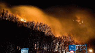 This photo provided by Adam Polinger shows a wildfire near the New Jersey side of the Delaware Water Gap National Recreation Area near Hardwick Township, N.J., Sunday, Feb. 23, 2020.