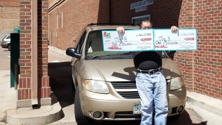 Joe B" from Pueblo, Colorado, claims the two $1 million Powerball prizes he won on March 25.