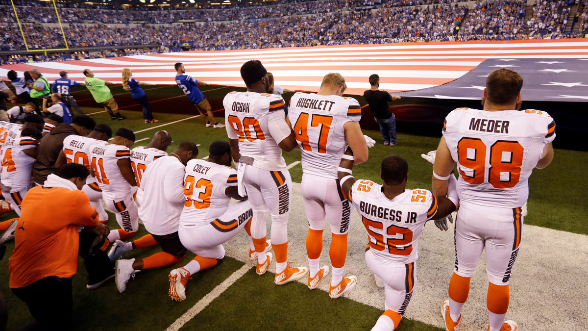 Members of the Cleveland Browns take a knee during the national anthem before an NFL football game against the Indianapolis Colts in Indianapolis, Sunday, Sept. 24, 2017.