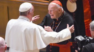 In this Sept. 23, 2015, file photo, Cardinal Archbishop emeritus Theodore McCarrick (C) greets Pope Francis (L) during Midday Prayer of the Divine with more than 300 U.S. Bishops at the Cathedral of St. Matthew the Apostle in Washington, DC.