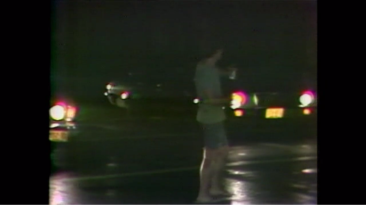 In this picture, you can see a civilian helping to direct traffic.