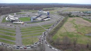 long lines outside a food share distribution site in East Hartford