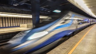 High speed train moves through station