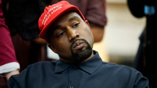 In this Oct. 11, 2018, file photo rapper Kanye West listens to a question from a reporter during a meeting in the Oval Office of the White House with President Donald Trump in Washington. On Sunday, Aug. 25, 2019, Kanye West hosted a Sunday Service in Ohio in support of those affected by the recent mass shooting. A large crowd gathered at the service in a park in Dayton.