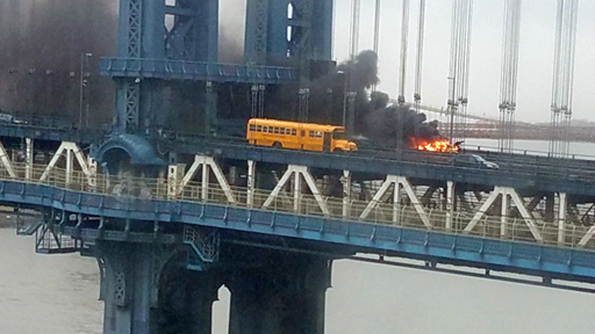 Flames Devour Taxi on Manhattan Bridge, Filling Air With Black Smoke