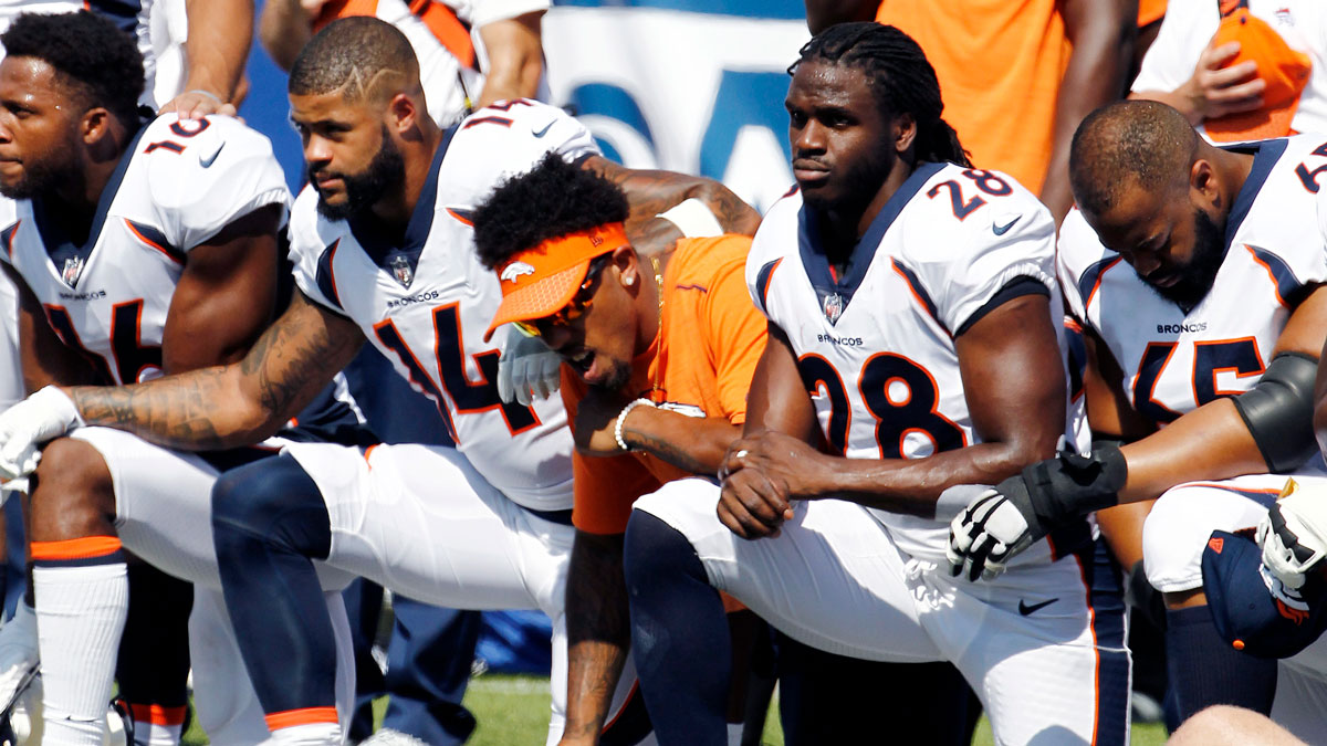Denver Broncos players, including Jamaal Charles (28) kneel during the national anthem prior to an NFL football game against the Buffalo Bills, Sunday, Sept. 24, 2017, in Orchard Park, N.Y.