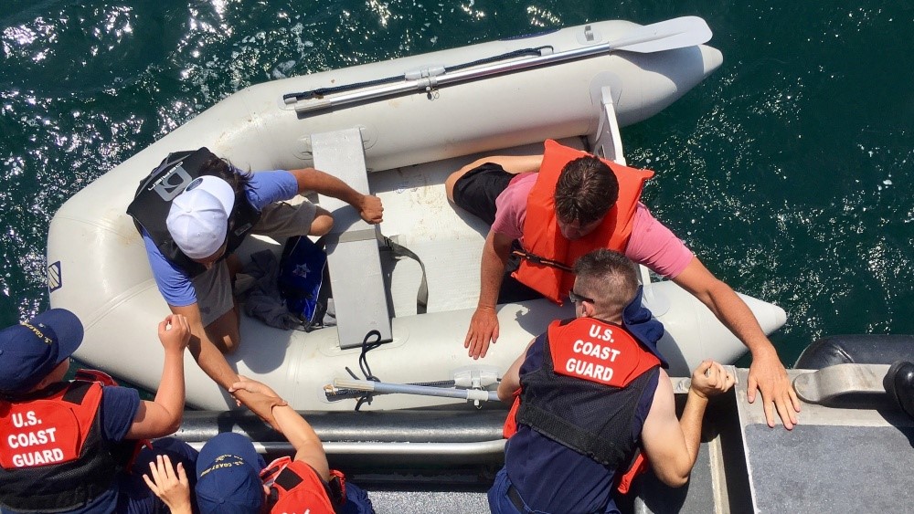 Coast Guard Rescues 2 Men From Shark-Infested Waters After Boat Sinks ...