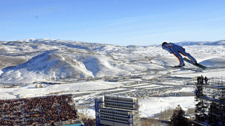 FILE - In this Feb. 10, 2002, file photo, Simon Ammann, of Switzerland, competes in the men's K90 Individual ski jump at the 2002 Salt Lake City Winter Olympics in Park City, Utah.