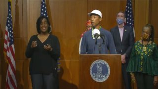 Musician Pharrell Williams and Virginia Gov. Ralph Northam