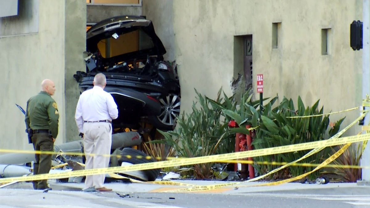 Officers Injured, Stolen Tesla Split in Half After Fiery Pursuit Wreck