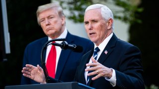 In this April 27, 2020, file photo, Vice President Mike Pence speaks at a briefing about the COVID-19 coronavirus pandemic as President Donald Trump looks on in the White House Rose Garden in Washington, D.C.