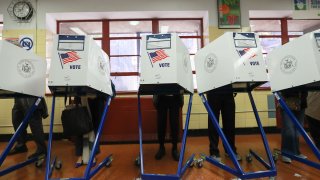 In this file poto, voters cast their ballots in 2016 in New York, United States.