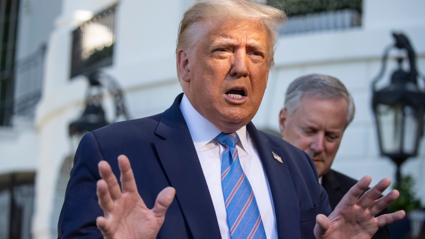 President Donald Trump speaks with reporters