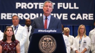 Bill de Blasio and New York City seal