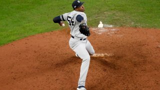 Aroldis Chapman #54 of the New York Yankees pitches in the ninth inning against the Houston Astros