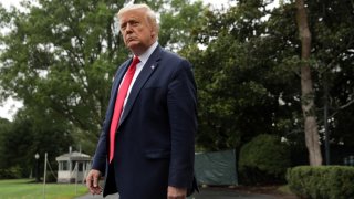 In this July 31, 2020, file photo, U.S. President Donald Trump comes out from the residence prior to a Marine One departure from the South Lawn of the White House in Washington, DC.