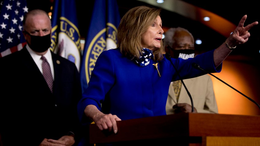 House Speaker Nancy Pelosi of Calif., accompanied by Rep. Dan Kildee, D-Mich., left, and Rep. Danny Davis, D-Ill., right, speaks at a news conference on Capitol Hill in Washington, July 24, 2020, on the extension of federal unemployment benefits.