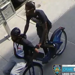 two men seen on a bike in surveillance images