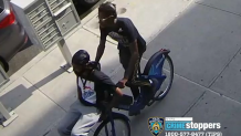 two men seen on a bike in surveillance images