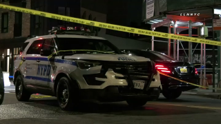 new york city police vehicle sits at scene of deadly crash