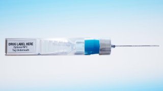 This undated image provided by ApiJect Systems America in July 2020 shows a prototype of their "BFS" prefilled syringe. The devices are self-contained: the soft plastic blister is squeezed to push a dosage through the attached needle to inject into a patient. It also includes a computer chip that can transmit information about the drug, dose, location and time of administration. When precious vats of COVID-19 vaccine are finally ready, the ability to jab the lifesaving solution into the arms of Americans will require hundreds of millions of injections. The Trump administration has agreed to invest more than half a billion in tax dollars in ApiJect Systems America, a young company whose injector is not approved by federal health authorities and who hasn’t yet set up a factory to manufacture the unapproved devices.