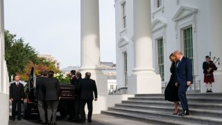 President Donald Trump, first lady Melania Trump, and members of the Trump family watch as the casket of Robert Trump leaves the White House after a memorial service, Friday, Aug. 21, 2020, in Washington.
