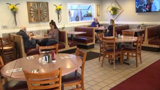Customers inside Lakeside Diner in New Jersey dine indoors despite the risks due to COVID and despite state mandate banning indoor dining in restaurants.