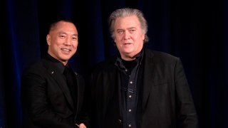 Former White House Chief Strategist Steve Bannon (R) greets fugitive Chinese billionaire Guo Wengui before introducing him at a news conference on November 20, 2018 in New York, on the death of of tycoon Wang Jian in France on July 3, 2018.