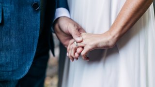 Bride and groom holding hands