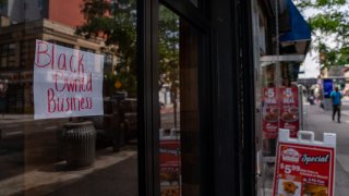 Store with black-owned business sign