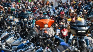 In this Aug. 7, 2020, file photo, motorcyclists ride down Main Street during the 80th Annual Sturgis Motorcycle Rally in Sturgis, South Dakota.
