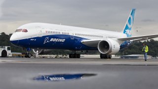 A Boeing 787-9 Dreamliner taxis after concluding its first flight September 17, 2013 at Boeing Field in Seattle, Washington. The 787-9 is twenty feet longer than the original 787-8, can carry more passengers and more fuel.