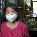Jane Lee inside her family's laundry business in Stuy Town