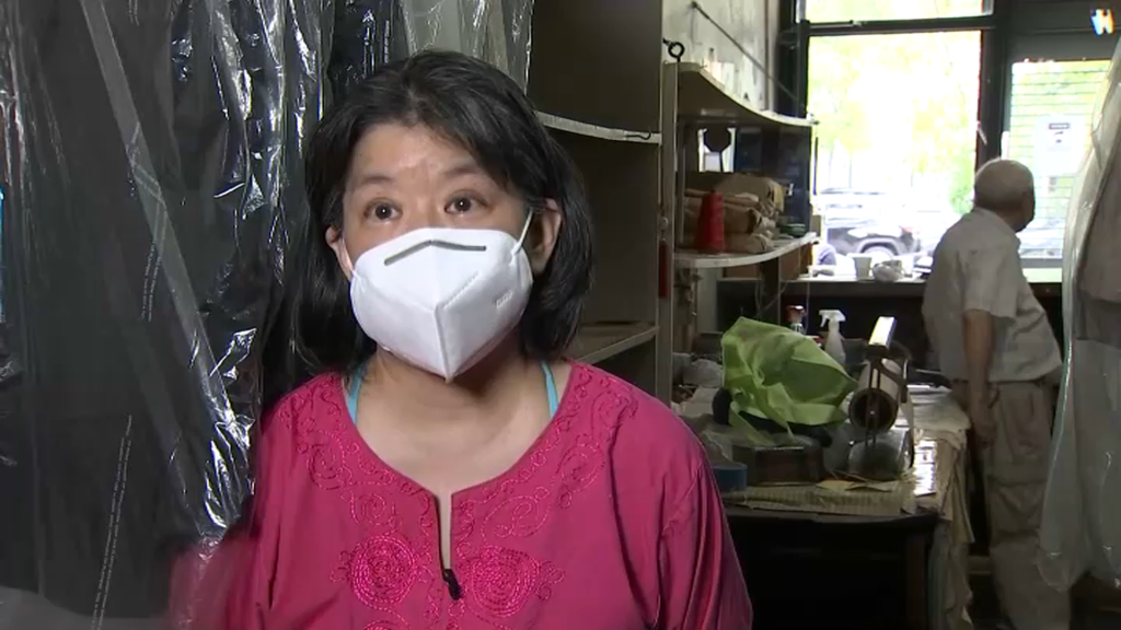 Jane Lee inside her family's laundry business in Stuy Town