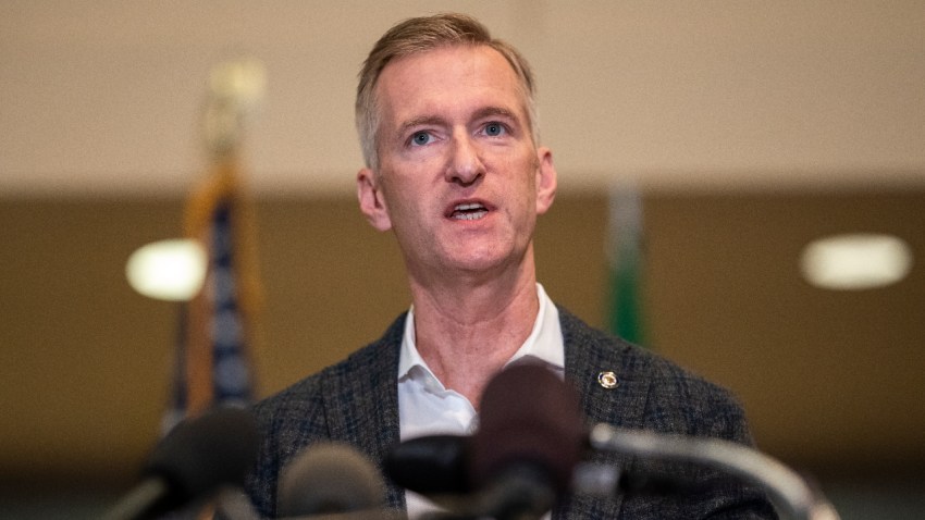Portland Mayor Ted Wheeler speaks to the media