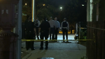 nypd officers investigate scene of deadly shooting in queens