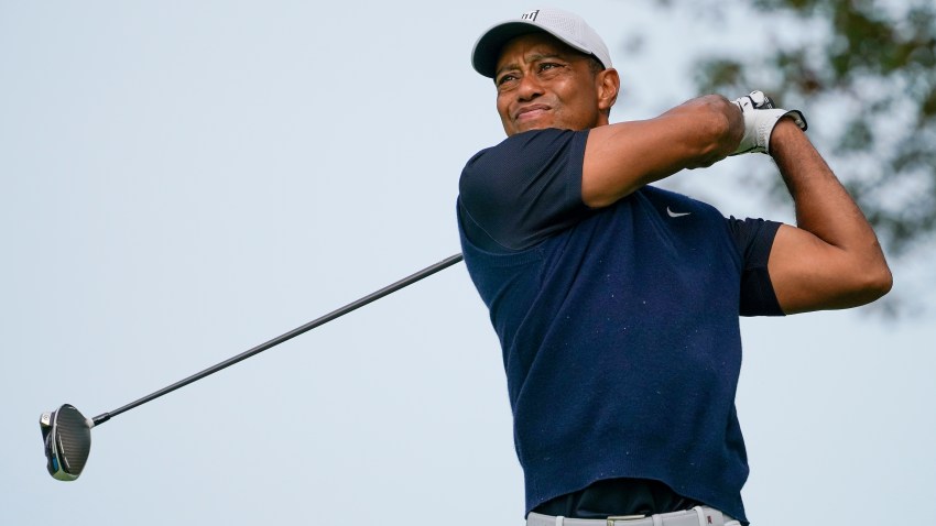 Tiger Woods, of the United States, plays his shot from the ninth tee during the first round of the US Open Golf Championship
