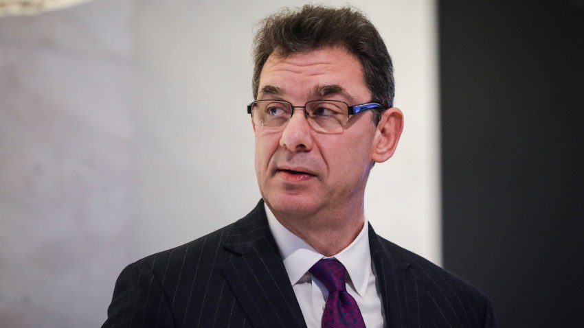 In this Jan. 17, 2019, file photo, Albert Bourla, chief executive officer of Pfizer pharmaceutical company, waits to ring the closing bell at the New York Stock Exchange (NYSE) in New York City.