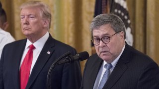 William Barr, U.S. attorney general, right, speaks during a Medal of Valor and Heroic Commendations ceremony with U.S. Donald Trump in the East Room of the White House in Washington, D.C., U.S., on Monday, Sept. 9, 2019. The Medal of Valor was given to six Dayton police officers who stopped the Ohio mass shooter last month and five civilians received heroic commendations for having helped others while a gunman opened fire at a Walmart in El Paso, Texas.